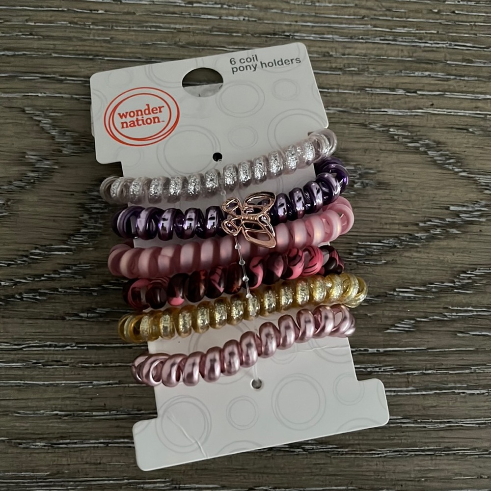 COIL PONY HOLDERS